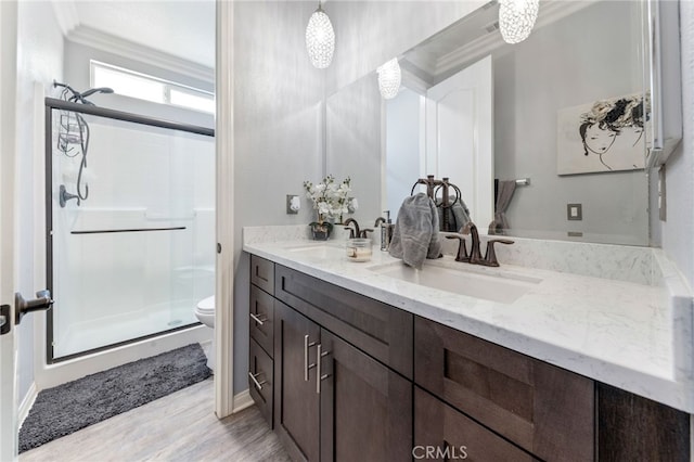 20900 Center St, Riverside, CA 92507 - full bathroom with double vanity, a stall shower, wood finished floors, and ornamental molding