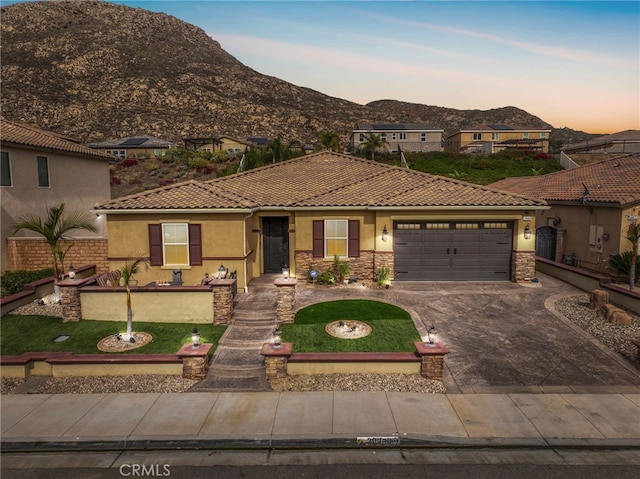 20900 Center St, Riverside, CA 92507 - view of front of house featuring stucco siding, a garage, a mountain view, a tile roof, and driveway