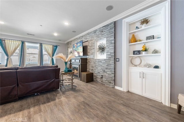 20900 Center St, Riverside, CA 92507 - living room featuring crown molding, a glass covered fireplace, wood finished floors, and built in features