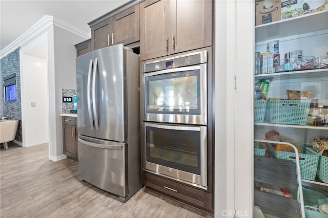 20900 Center St, Riverside, CA 92507 - kitchen featuring stainless steel appliances, light wood-type flooring, and crown molding