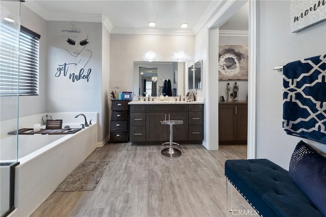 20900 Center St, Riverside, CA 92507 - bathroom featuring wood finished floors, vanity, a bath, and ornamental molding