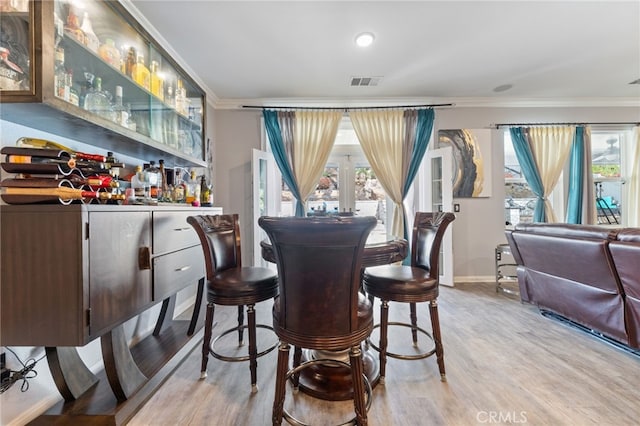 20900 Center St, Riverside, CA 92507 - dining room featuring crown molding, a bar, and wood finished floors