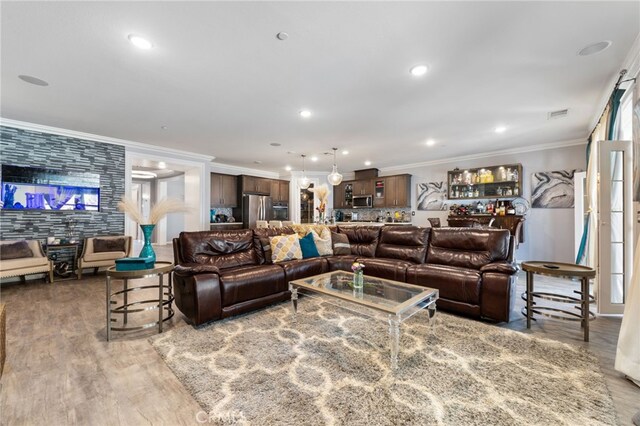 20900 Center St, Riverside, CA 92507 - living area with ornamental molding, wood finished floors, and recessed lighting