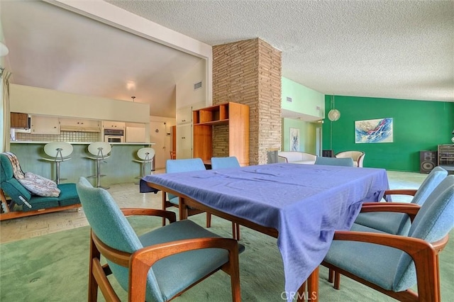 rec room with lofted ceiling with beams, carpet, visible vents, and a textured ceiling