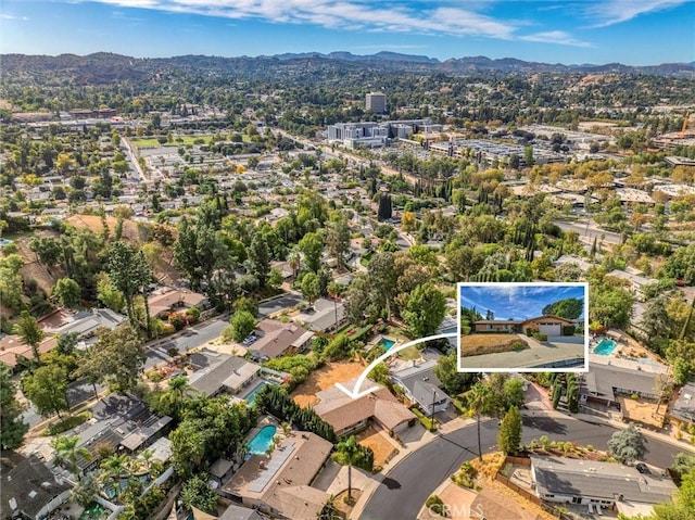 drone / aerial view featuring a mountain view