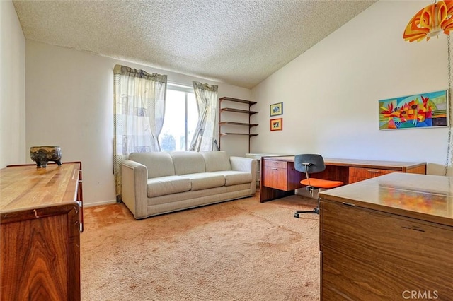 office featuring vaulted ceiling, a textured ceiling, and light colored carpet