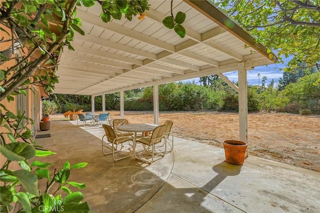 view of patio featuring outdoor dining area