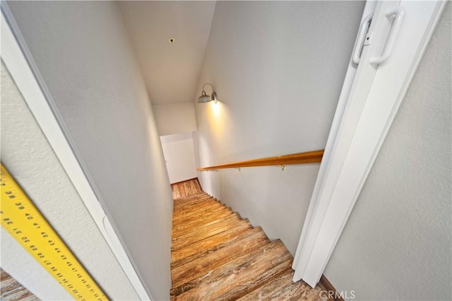 stairs with wood finished floors