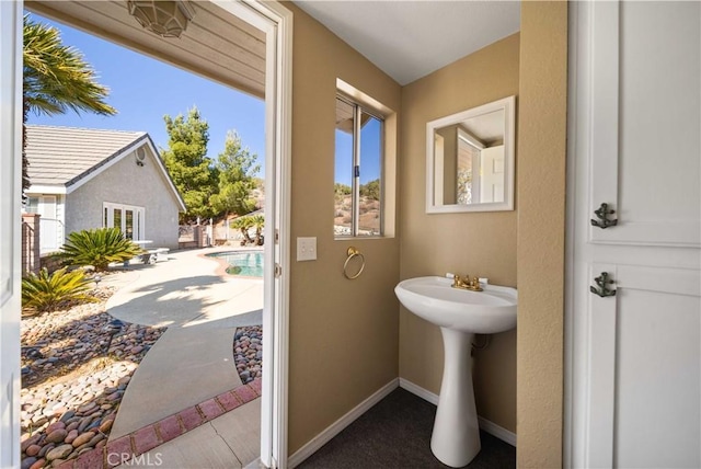 bathroom featuring baseboards