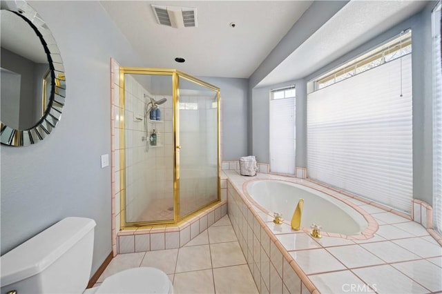 full bath with visible vents, toilet, a shower stall, a bath, and tile patterned floors