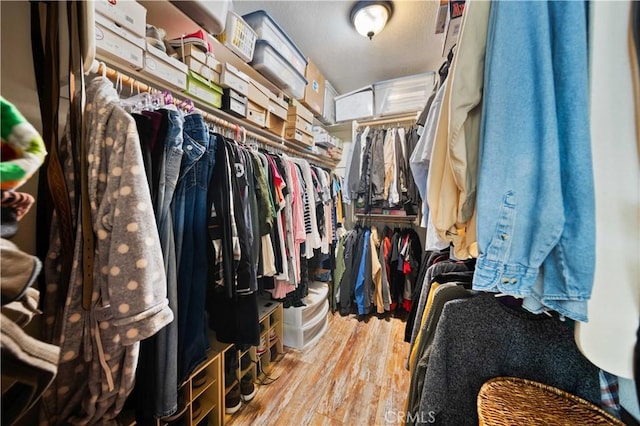 spacious closet with wood finished floors