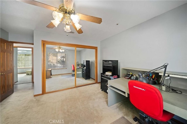 office space featuring light colored carpet and baseboards