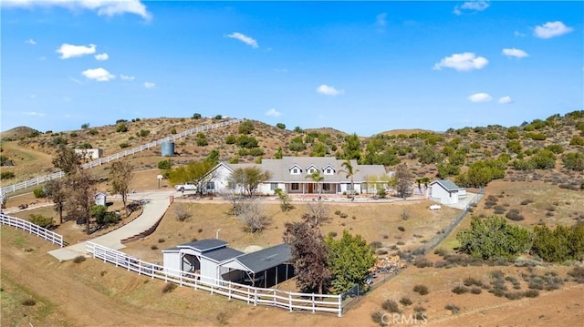 birds eye view of property featuring a rural view and a mountain view