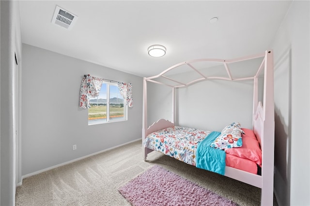 bedroom with visible vents, baseboards, and carpet floors