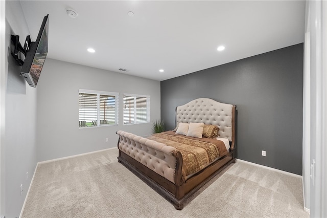 carpeted bedroom with recessed lighting, visible vents, and baseboards