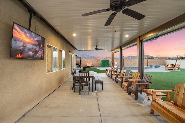 view of patio featuring a fenced backyard and a ceiling fan