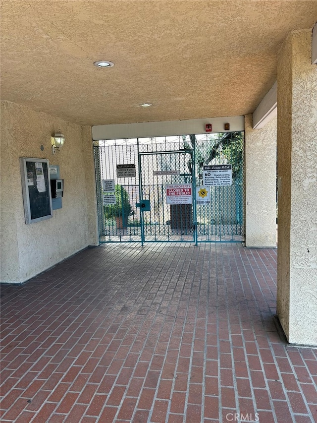 view of patio with a gate