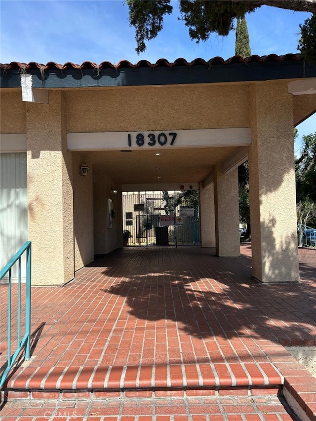 view of patio featuring a gate