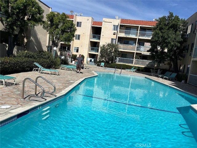 pool featuring a patio area