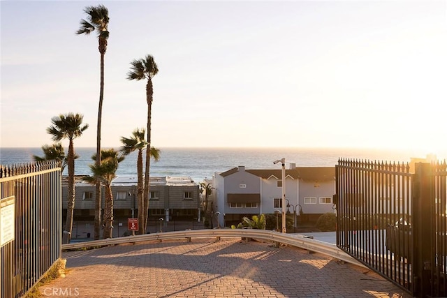 property view of water featuring fence