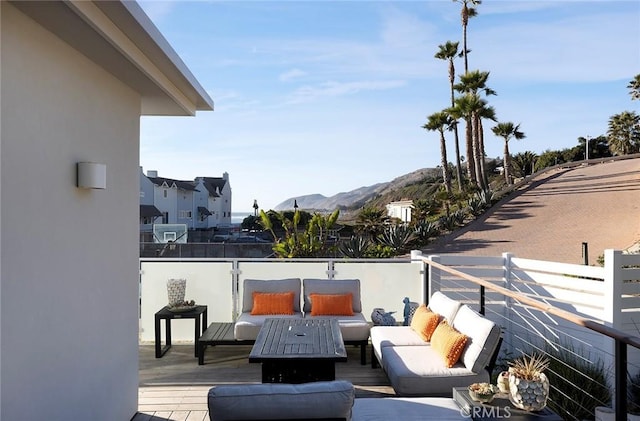 exterior space featuring a mountain view and an outdoor living space