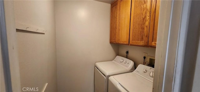 laundry area featuring cabinet space and washer and dryer