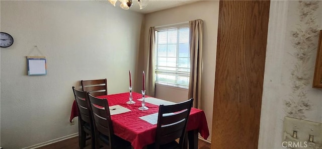 dining area featuring plenty of natural light and baseboards