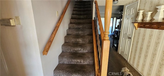 stairway with ceiling fan