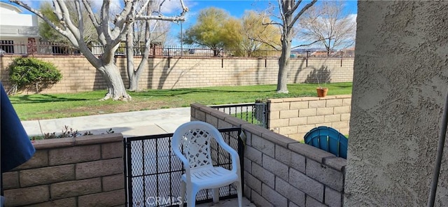 view of patio / terrace with a fenced backyard and a gate