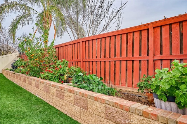 exterior details featuring a fenced backyard