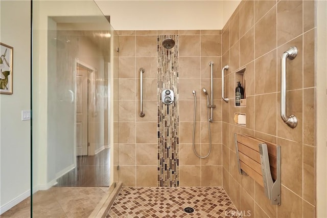 full bathroom with a tile shower