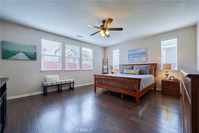 bedroom featuring baseboards, visible vents, ceiling fan, and dark wood-style flooring