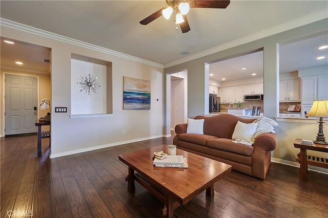 living area featuring ornamental molding, dark wood-type flooring, recessed lighting, and baseboards