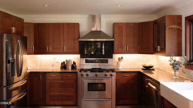 kitchen featuring stainless steel appliances, ornamental molding, wall chimney exhaust hood, and decorative backsplash