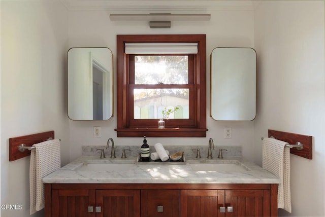 bathroom with a sink and double vanity