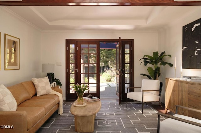 doorway featuring ornamental molding and a tray ceiling