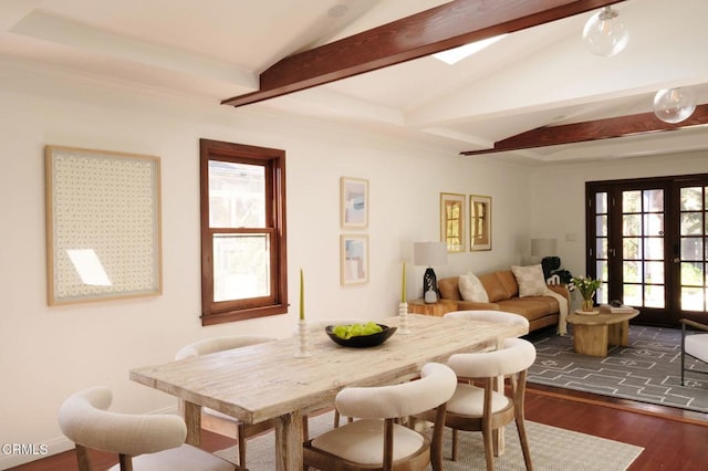 dining area featuring a wealth of natural light, dark wood finished floors, vaulted ceiling with beams, and french doors