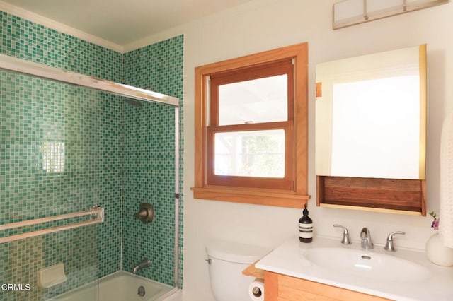 full bath featuring shower / bath combination with glass door, vanity, and toilet