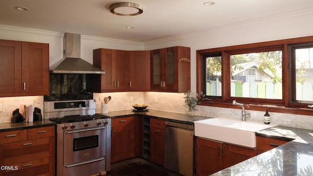 kitchen featuring stainless steel appliances, a sink, ornamental molding, decorative backsplash, and wall chimney exhaust hood