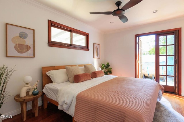 bedroom featuring baseboards, ornamental molding, ceiling fan, and wood finished floors