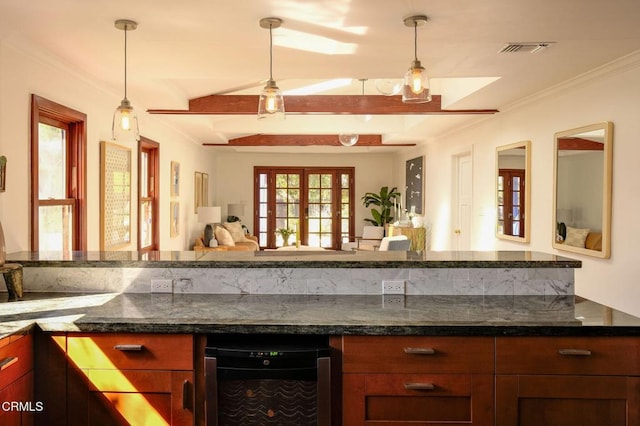 bar featuring ornamental molding, beverage cooler, visible vents, and decorative light fixtures