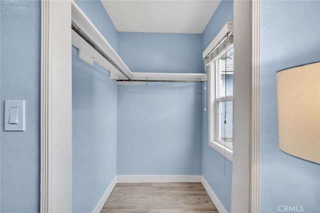 spacious closet featuring wood finished floors