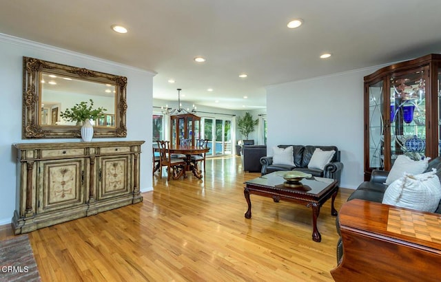 living area featuring crown molding, recessed lighting, and light wood-style floors