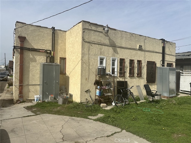 view of property exterior featuring a patio and stucco siding