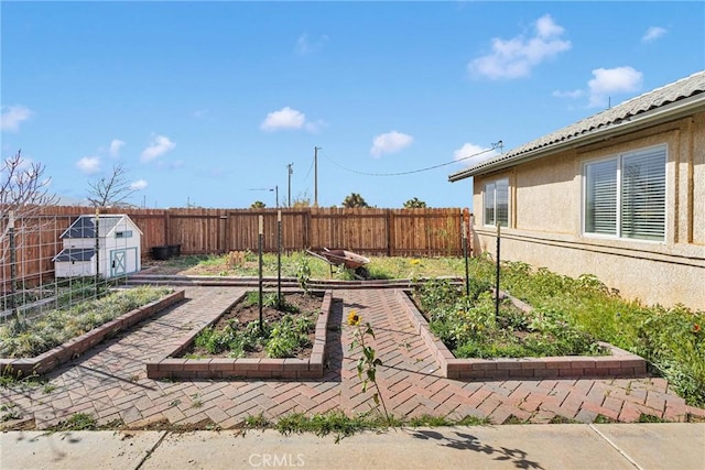 view of yard with fence private yard and a garden