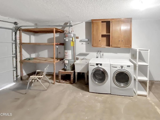 clothes washing area with water heater, cabinet space, washing machine and dryer, a sink, and a textured ceiling