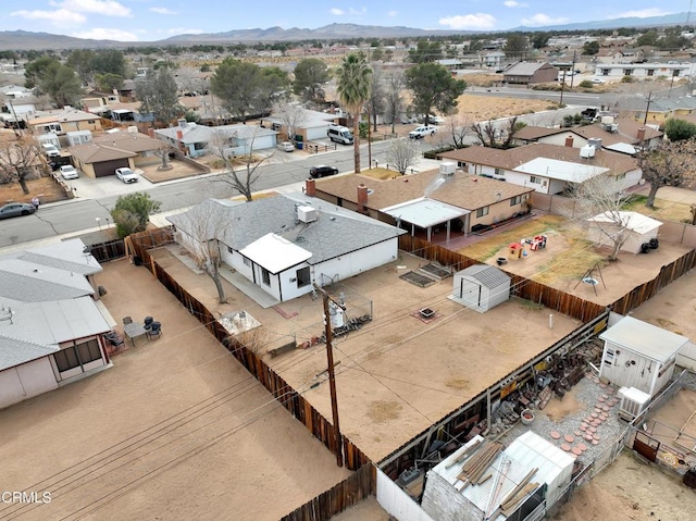 drone / aerial view with a residential view and a mountain view