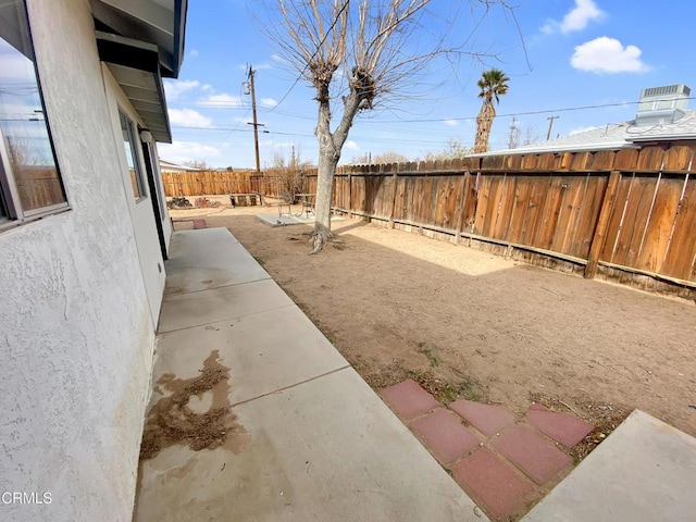 view of yard with a patio area and a fenced backyard