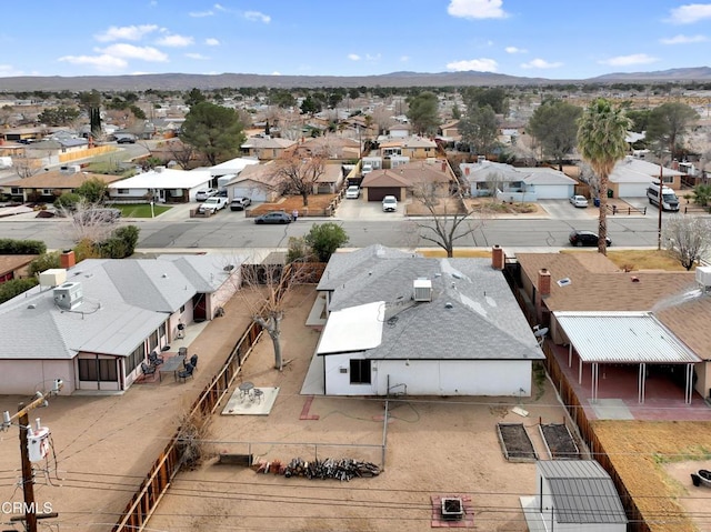 birds eye view of property with a residential view and a mountain view