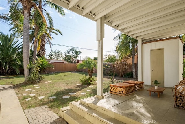 view of yard featuring an outbuilding and fence private yard